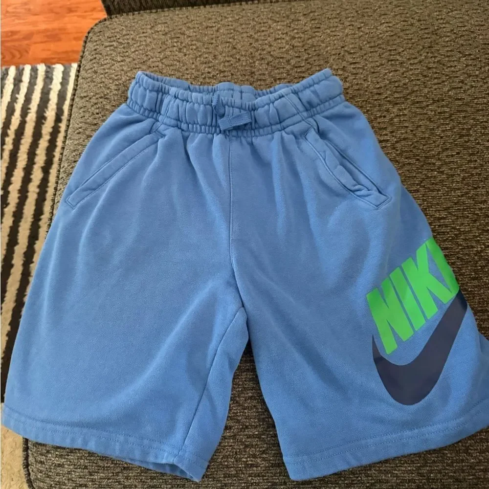 Nike Sportswear Club Fleece shorts royal blue with green Nike and black check